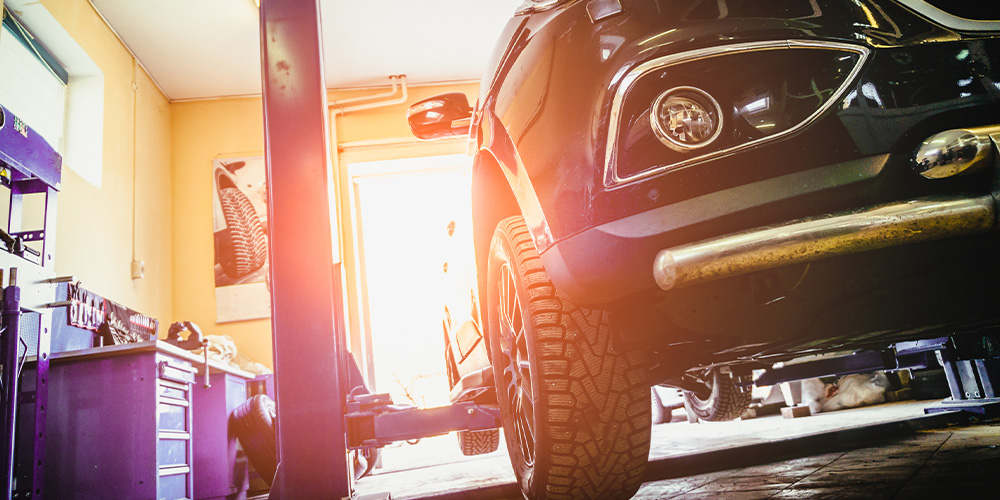 Image Of Employee Fixing Vehicle